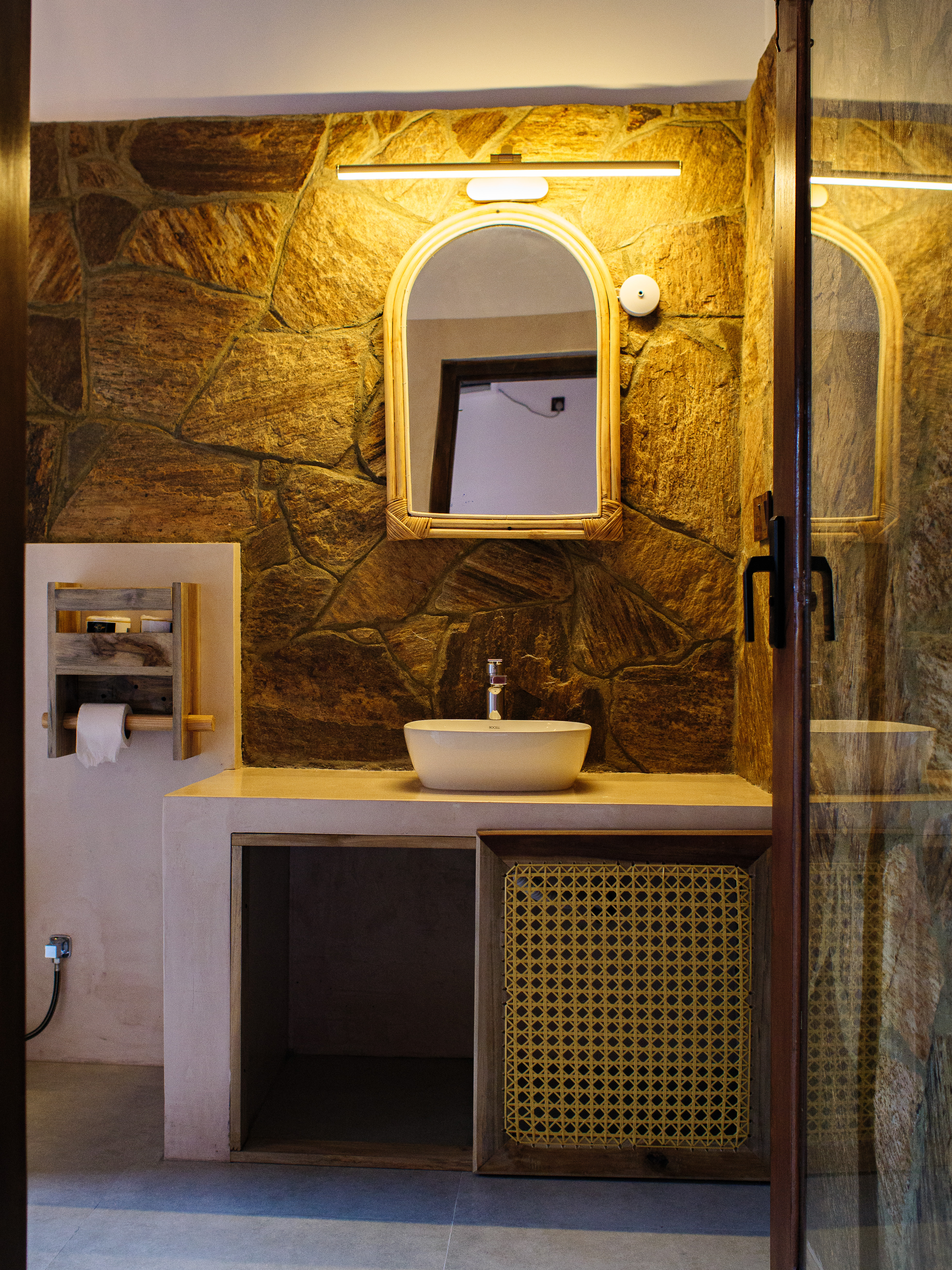 Tropical stone-walled bathroom with vessel sink — Pine & Palm, Arugam Bay